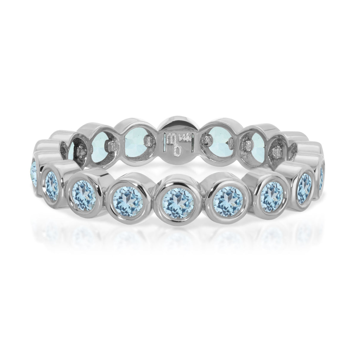 The Forget Me Not Bouquet Ring in white gold on a white background. 