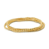 A Dainty Bubble Bracelet Set in yellow gold on a white background. 