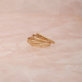 Delicate Trio Stacking Rings on a light pink marble background. 