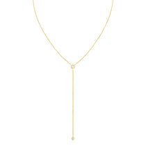 A Diamond Drip Necklace in yellow gold on a white background. 