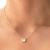 Close-up of a neck wearing a C’est Moi Deco Necklace in yellow gold. 