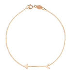 A Straight as an Arrow Bracelet in rose gold on a white background. 