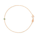 Rose gold bracelet with a small emerald green birthstone charm on a white background.