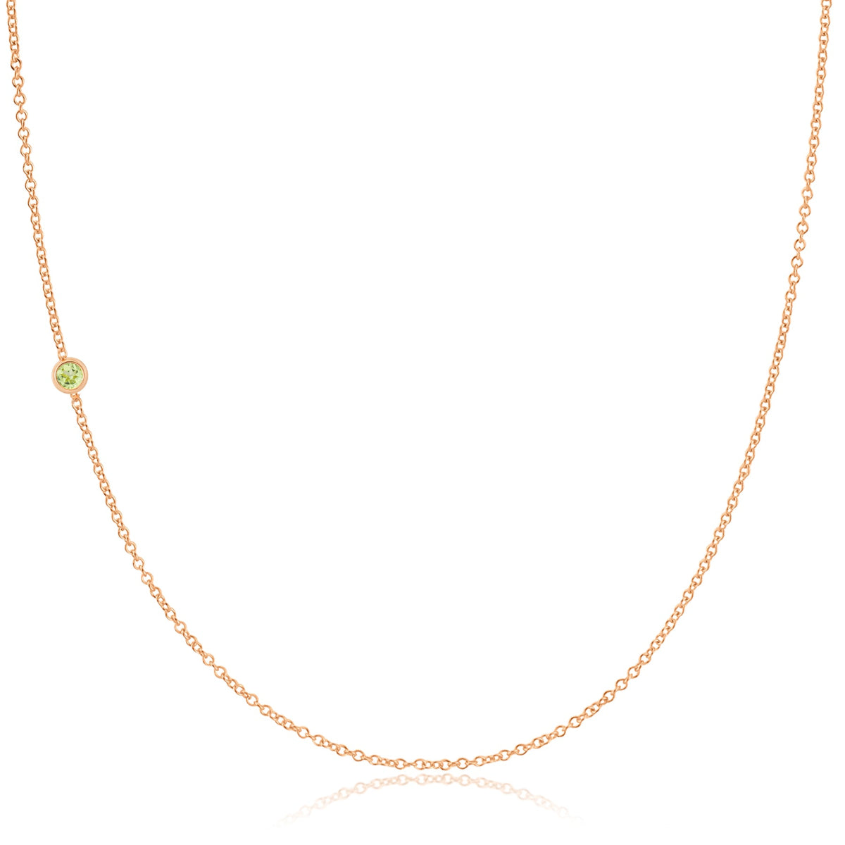 A rose gold 14K Gold Asymmetrical Birthstone Necklace - Peridot (August) on a white background. 