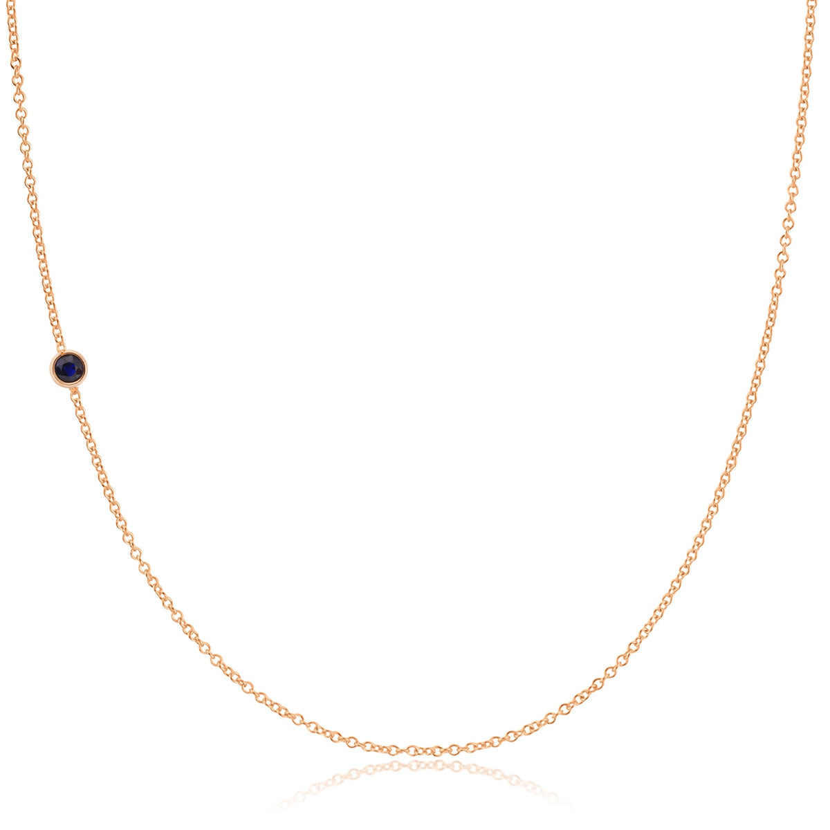 A rose gold 14K Gold Asymmetrical Birthstone Necklace - Sapphire (September) on a white background. 