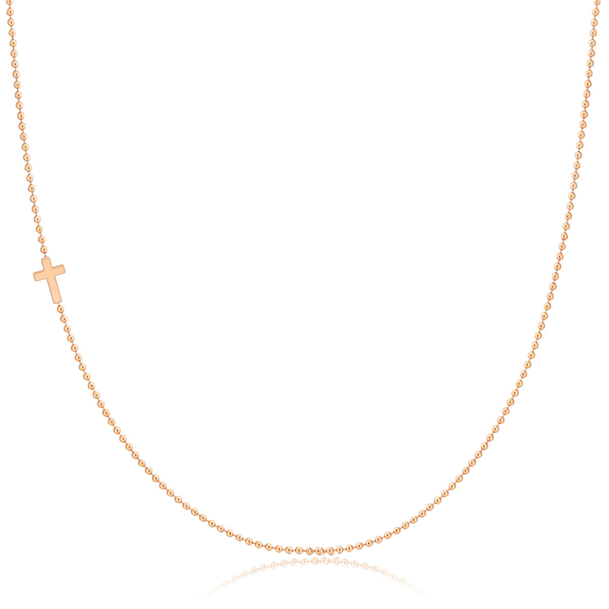 A rose gold 14k Gold Asymmetrical Charm Necklace - Cross with a bead chain on a white background. 