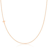 A rose gold 14k Gold Asymmetrical Charm Necklace - Cross with a bead chain on a white background. 