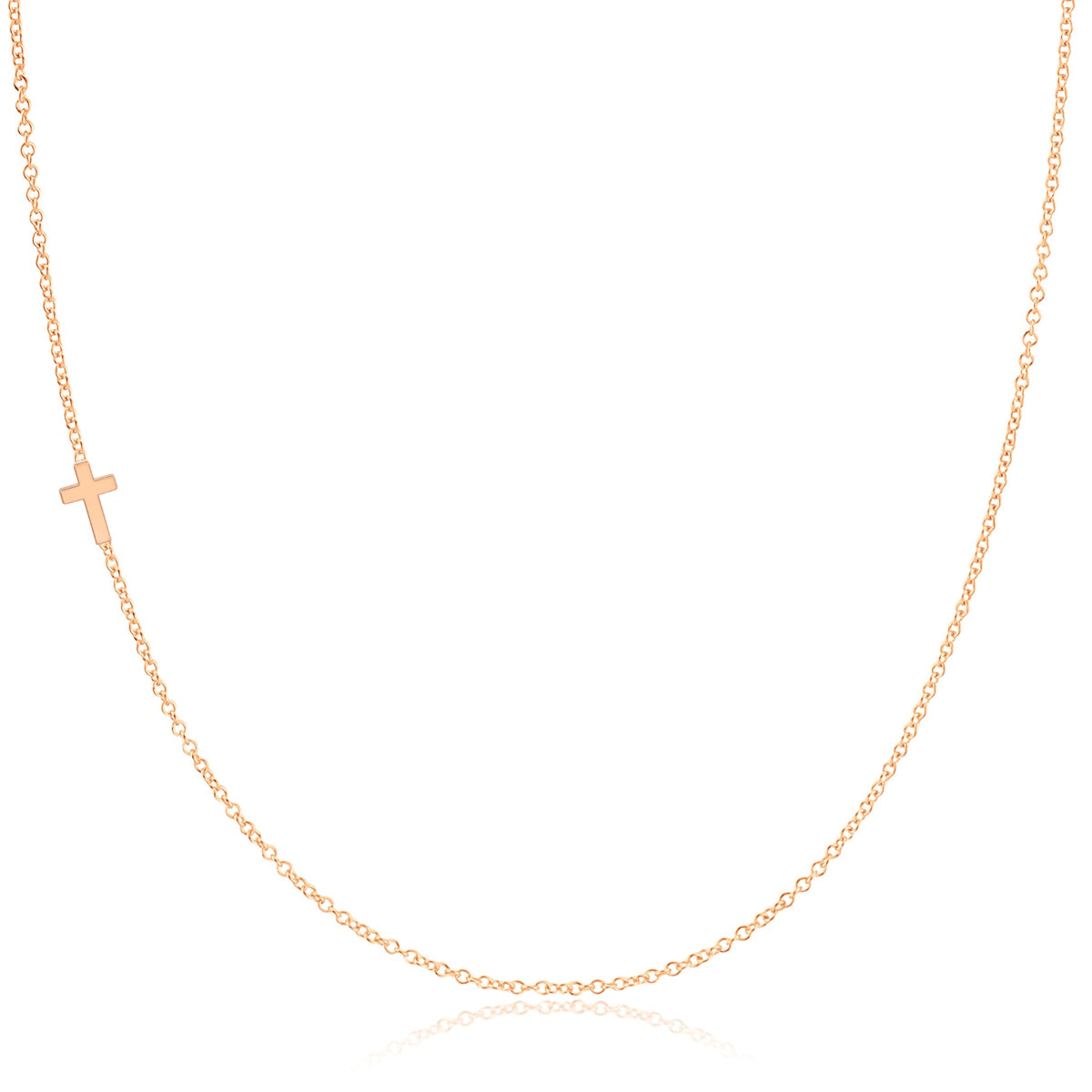 A rose gold 14k Gold Asymmetrical Charm Necklace - Cross with a cable chain on a white background. 