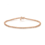 A Down the Line Bracelet in rose gold on a white background.