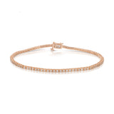 A Down the Line Bracelet in rose gold on a white background.