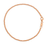 A Diamond Cut Bracelet in rose gold on a white background. 
