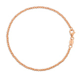 A Diamond Cut Bracelet in rose gold on a white background. 