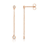 Droplet Diamond Earrings in rose gold on a white background. 