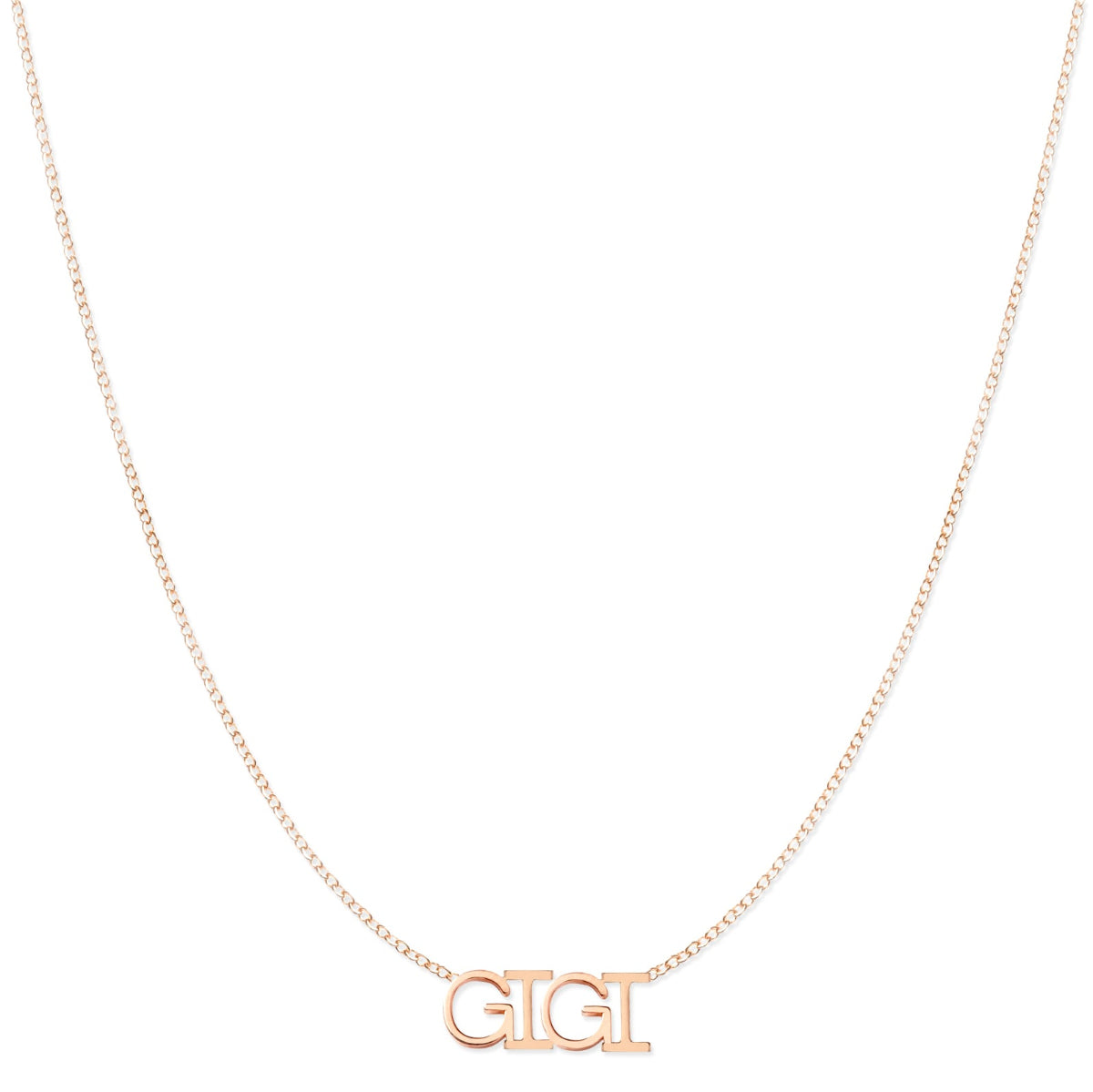 A GIGI Necklace in rose gold on a cable chain on a white background.