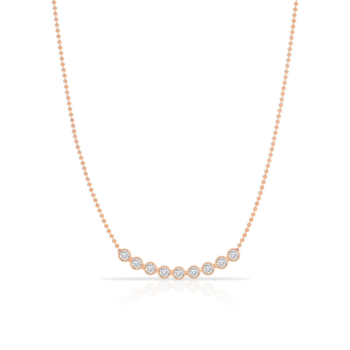 A Diamond Arc Layering Necklace in rose gold on a white background. 
