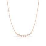 A Diamond Arc Layering Necklace in rose gold on a white background. 