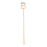 A rose gold threader earring with a letter B stud on a white background.
