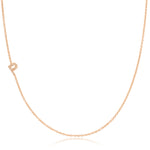 A rose gold necklace with a pave letter P charm on a white background. 
