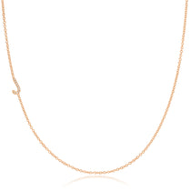 A rose gold necklace with a pave letter J charm on a white background. 