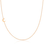 A rose gold 14k Gold Asymmetrical Charm Necklace - Moon with a bead chain on a white background. 