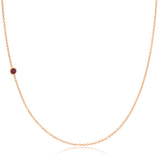 A rose gold 14K Gold Asymmetrical Birthstone Necklace - Ruby (July) on a white background. 