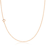 A rose gold necklace with a P letter charm on a white background. 