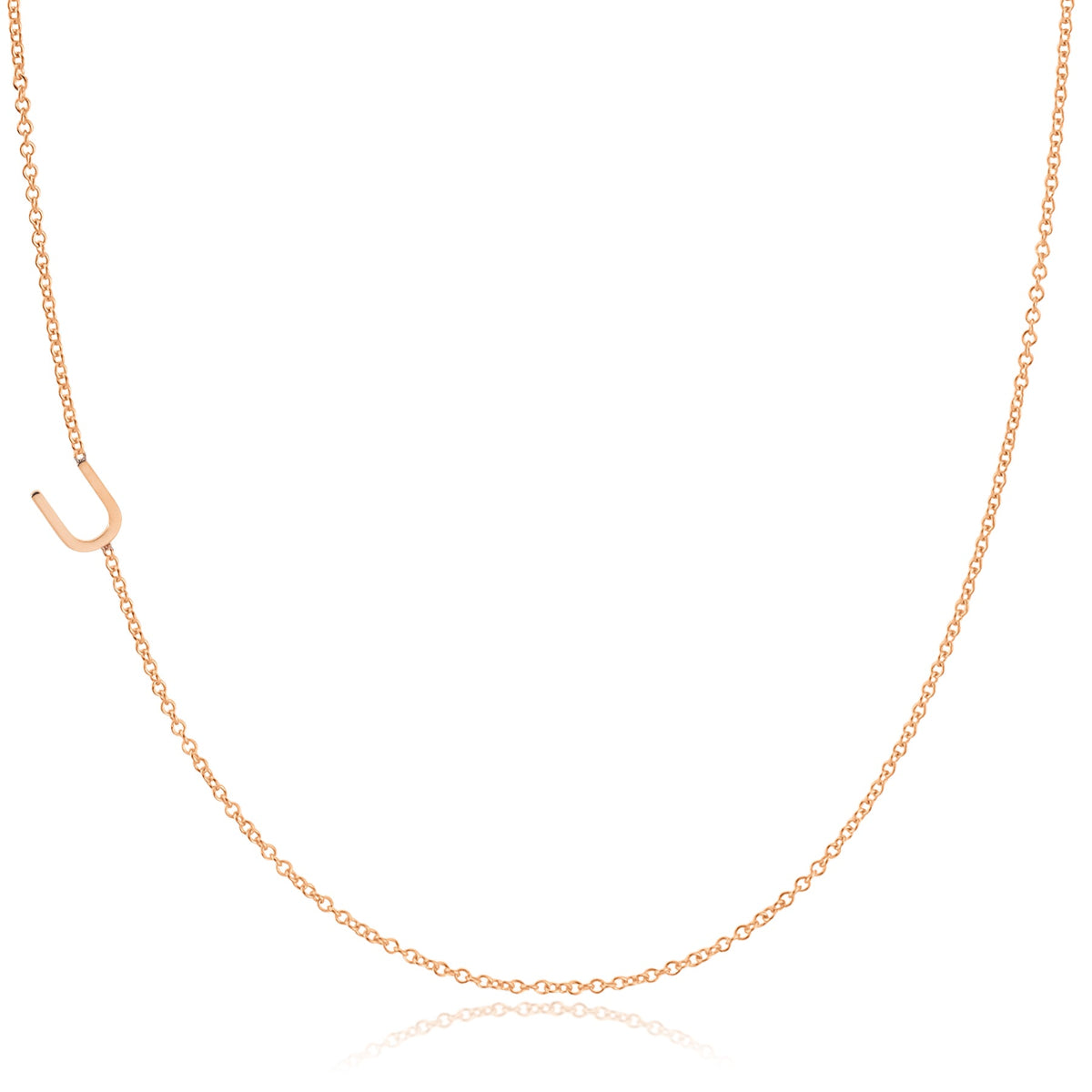 A rose gold necklace with a U letter charm on a white background. 