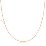 A rose gold necklace with a V letter charm on a white background. 