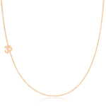 A rose gold 14k Gold Asymmetrical Charm Necklace - Om with a cable chain on a white background. 