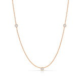 Triple Diamond Layering Necklace in rose gold on a white background. 