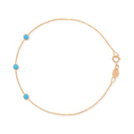 A rose gold Custom Gold Bracelet - 3 Letters with turquoise birthstones on a white background. 