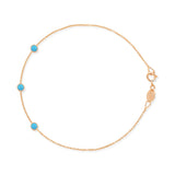 A rose gold Custom Gold Bracelet - 3 Letters with turquoise birthstones on a white background. 