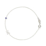 A white gold Custom Gold Bracelet - 2 Letters (a letter K charm and tanzanite birthstone) on a white background. 