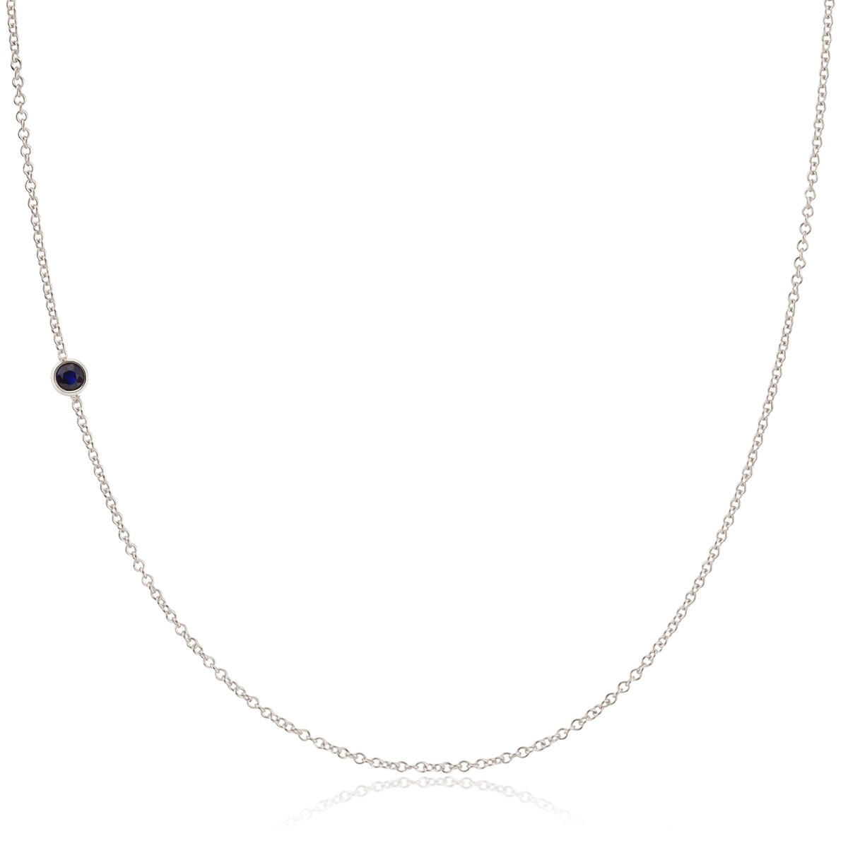 A white gold 14K Gold Asymmetrical Birthstone Necklace - Sapphire (September) on a white background. 