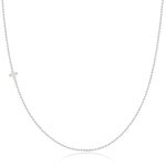 A white gold 14k Gold Asymmetrical Charm Necklace - Cross with a bead chain on a white background. 
