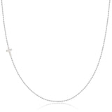 A white gold 14k Gold Asymmetrical Charm Necklace - Cross with a bead chain on a white background. 