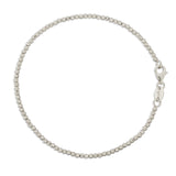 A Diamond Cut Bracelet in white gold on a white background. 