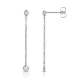 Droplet Diamond Earrings in white gold on a white background. 