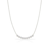 A Diamond Arc Layering Necklace in white gold on a white background. 
