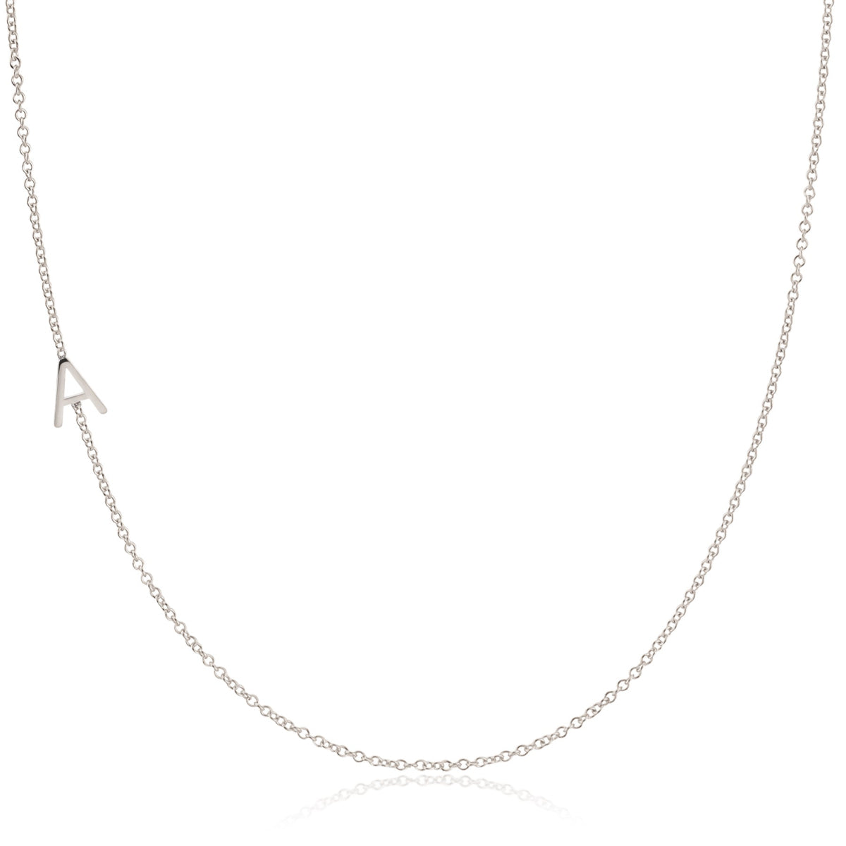 A white gold necklace with an A letter pave charm on a white background. 