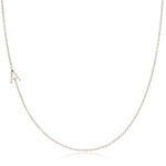 A white gold necklace with an A letter pave charm on a white background. 
