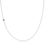 A white gold 14K Gold Asymmetrical Birthstone Necklace - Tanzanite (December) on a white background. 