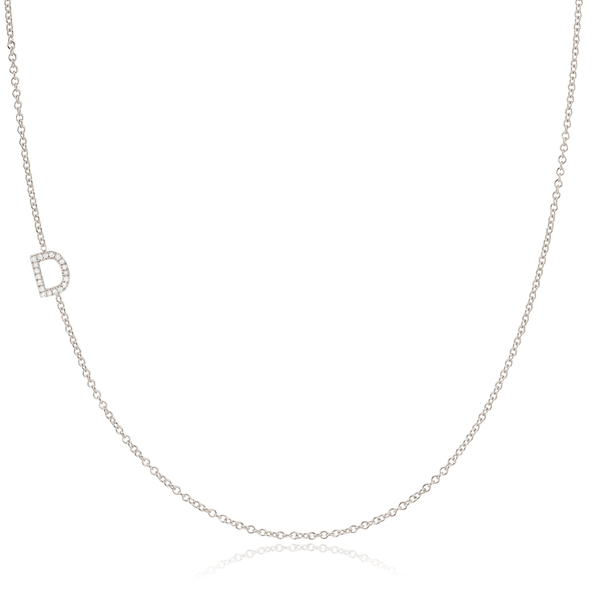 A white gold necklace with a D letter pave charm on a white background. 