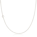 A white gold necklace with a F letter charm on a white background. 