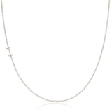 A white gold necklace with an I letter charm on a white background. 