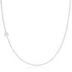 A white gold necklace with a letter A charm on a white background. 