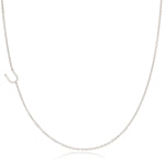 A white gold necklace with a U letter charm on a white background. 