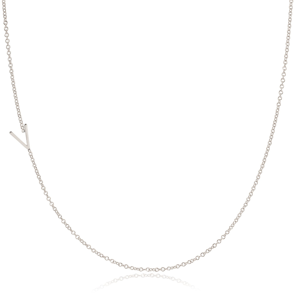 A white gold necklace with a V letter charm on a white background. 
