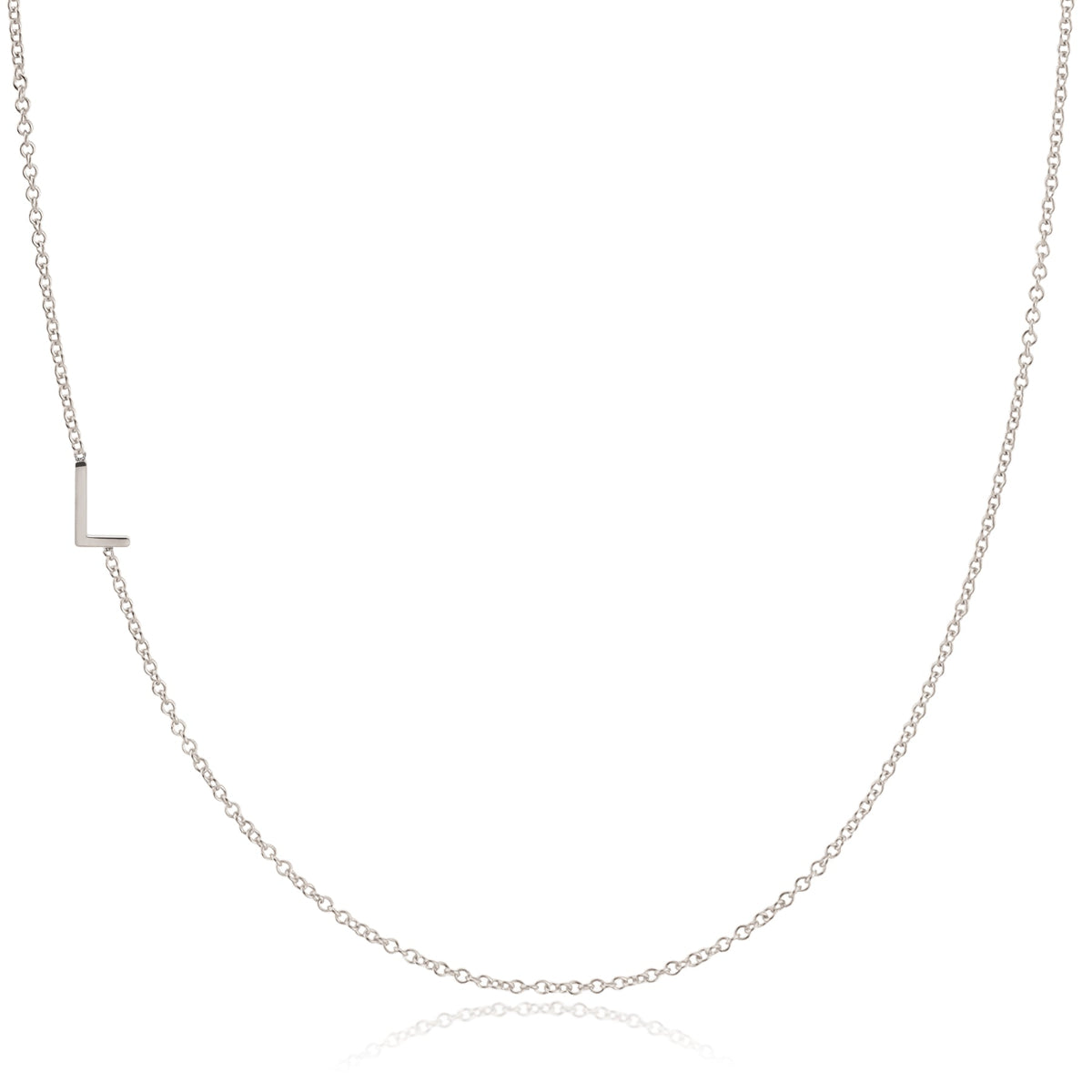 A white gold necklace with a L letter charm on a white background. 