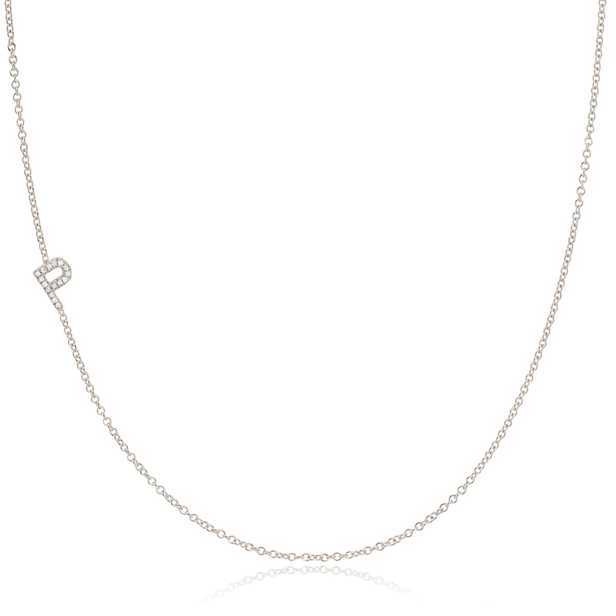 A white gold necklace with a letter P pave charm on a white background.